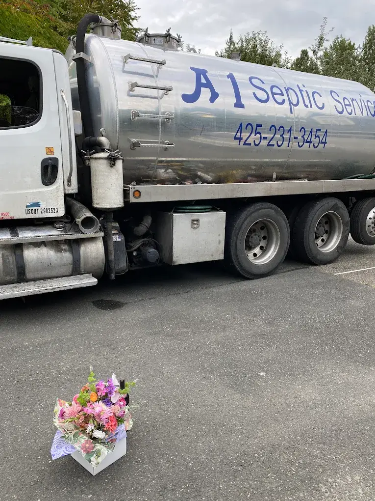 A1 Septic Service truck with memorial flowers